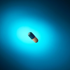 pill floating above the blue background