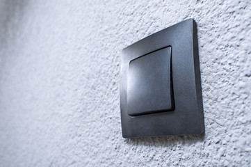 black switch on the wall textured