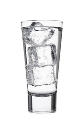 Glass of sparkling mineral water with ice cubes