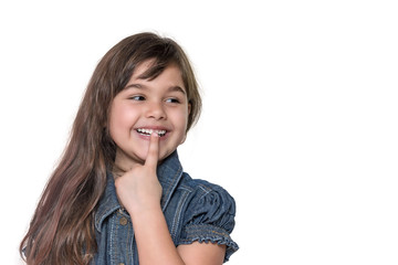 Portrait of smiling brunette long haired ltitle girl isolated on the white background.