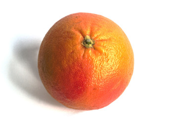 Closeup of a red grapefruit on a white background