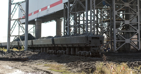 Fototapeta premium Loading of iron ore in train cars