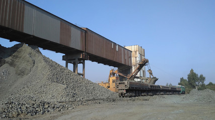 Loading of iron ore in train cars