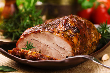 Roast pork with herbs and vegetables. © gkrphoto