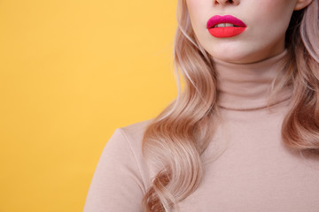Cropped photo of young blonde lady with bright makeup lips
