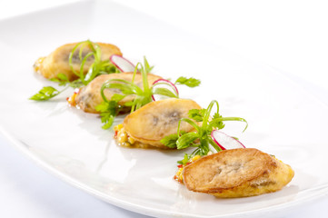 Banana canapes with spicy cornmeal 