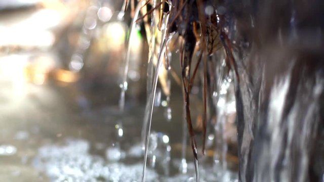 Running water in a stream of melted snow