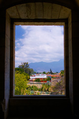 Mexico Oaxaca Santo Domingo monastery view from window to town clouds and mountains