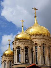 Fototapeta na wymiar Three gold domes of Orthodox Basilica convent in Ein Kerem, near Jerusalem, Israel