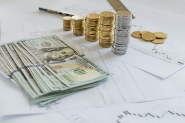 Forex charts and dollar coins