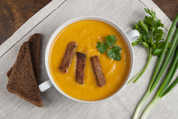 Bowl with pumpkin soup