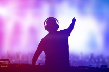 Charismatic disc jockey at the turntable.