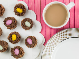 Obraz na płótnie Canvas Easter Chocolate Crispy Cereal Nests With Mini Easter Eggs
