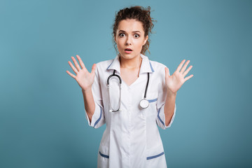 Shocked young nurse with stethoscope