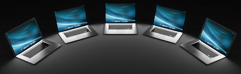 Five modern laptop in the dark 3D rendering