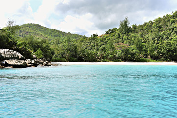 Beach Anse Georgette on La Digue, Seychelles, seen from the sea