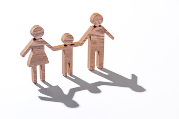 Family figure wooden modelling isolated on white with shadow.