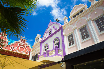 Example of vibrant and colorful Dutch architecture on buildings in Caribbean city of downtown Oranjestad, Aruba  - obrazy, fototapety, plakaty