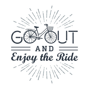 Hand drawn textured vintage label with bicycle vector illustration and inspirational lettering. Go out and enjoy the ride.