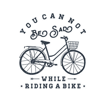 Hand drawn textured vintage label with bicycle vector illustration and inspirational lettering. You can not be sad while riding a bike.