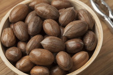 Bowl with whole pecan nuts