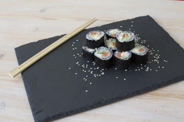 Sushi on black slate plate