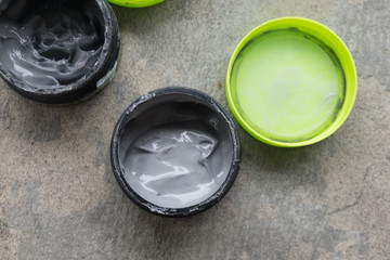 Open hair wax and clay in tubs