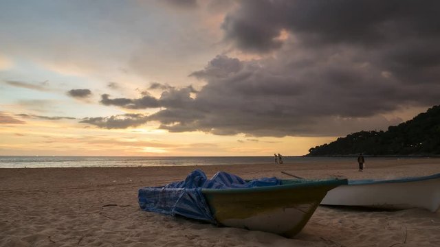 4K Time - lapse  boat with movement cloud and sunset at karon bech , PHUKET THAILAND.