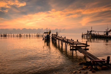 Fototapeta premium Sunrise on beach and boat fisherman,Thailand