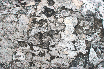 Surface of old damaged stone wall