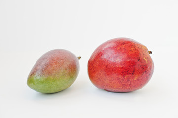 Exotic fruit mango or mangoes are juicy stone fruit isolated on white background. Healthy eating dieting food.