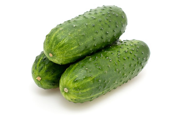 Fresh cucumber on white