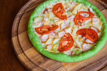 Pizza with chicken pineapple and green dough