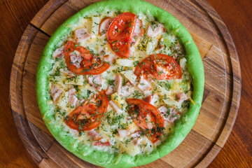 Pizza with chicken pineapple and green dough