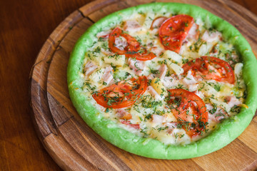 Pizza with chicken pineapple and green dough