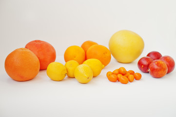 Different type of citrus. Exotic fruits kumquat with orange,lemon, blood (sicilian) orange and grapefruit isolated on white background. Healthy eating dieting food.