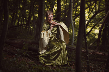Obraz na płótnie Canvas Elfin maiden posing in fairy forest