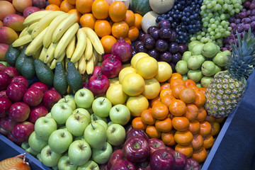 Wide angle photo of assortment organic fruits on retail market