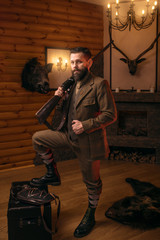 Respectable hunter man with old gun 