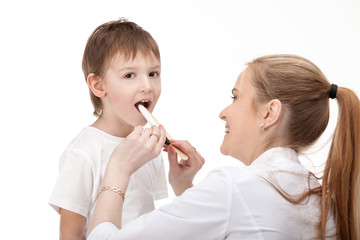 Doctor woman looking little boy child  listens stethoscope . Isolated white background .