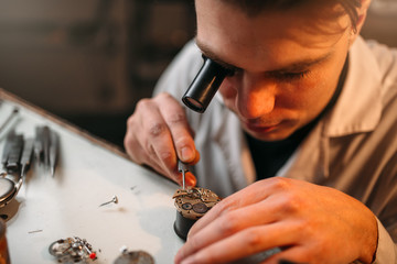 Watchmaker with loupe repair clockwork mechanism
