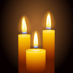 Fototapeta na wymiar Set of three burning candles