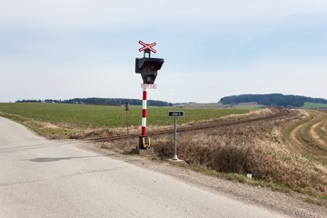 Railway crossing in the Czech Republic. Road crossing over the tracks. The inscription 