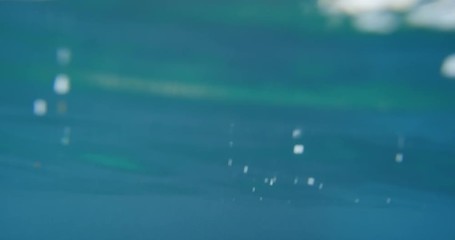 Athletic women jumping from cliff into sea best friends enjoying European summer holiday travel vacation adventure in Amalfi Coast Italy