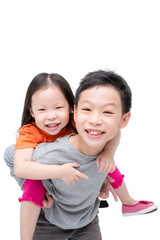 Happy Asian sibling isolated over white background