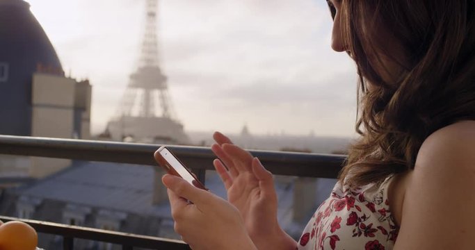 Woman holding smartphone Paris texting sharing lifestyle photo enjoying  holiday European   vacation travel adventure France 