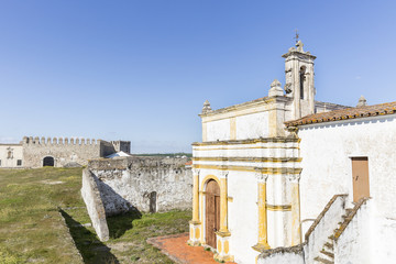 Fototapeta na wymiar Senhor dos Aflitos church and the Castle inside the Medieval wall in Campo Maior city, Portalegre district, Portugal