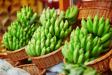 Green bananas on traditional farmer market on Madeira