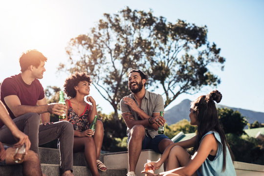 Multiracial young people partying outdoors