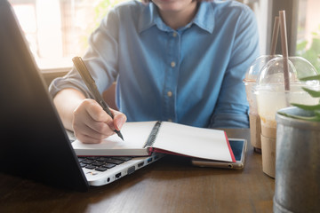 Young Asian woman working in coffee shop